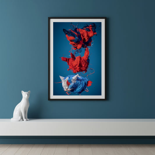 Three abstract, floating cat figures made of textured, thread-like fur in bold red and blue colours against a solid blue background. The top two cats appear fragmented and partially unravelled, with strands of fibre swirling around them, while the lower cat is more intact, with closed eyes and a calmer expression. The style is surreal and sculptural, blending organic feline shapes with dynamic, shredded textile elements.