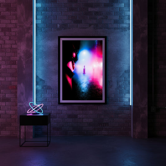Framed artwork with colorful abstract design on a brick wall with neon lights.