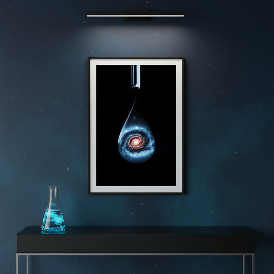 Framed artwork of a cosmic scene on a dark wall with a table and beaker below.