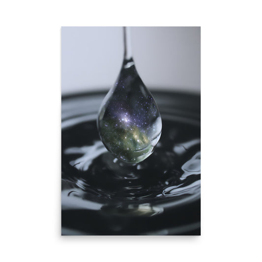 Art print of a water droplet with a reflective surface and galaxy-like pattern.